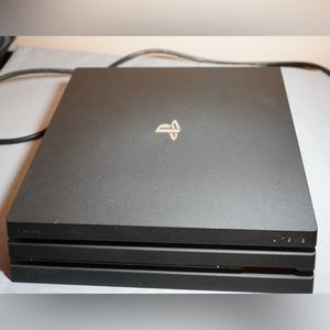 Playstation 4 Pro - 1 TB w/ no controller and 8 games